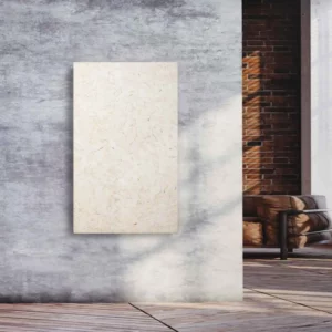 Natursteinheizung Silvia antik als warmer Wandakzent in einem Loft mit Sichtbeton und Ziegelwand – Luxuswärme