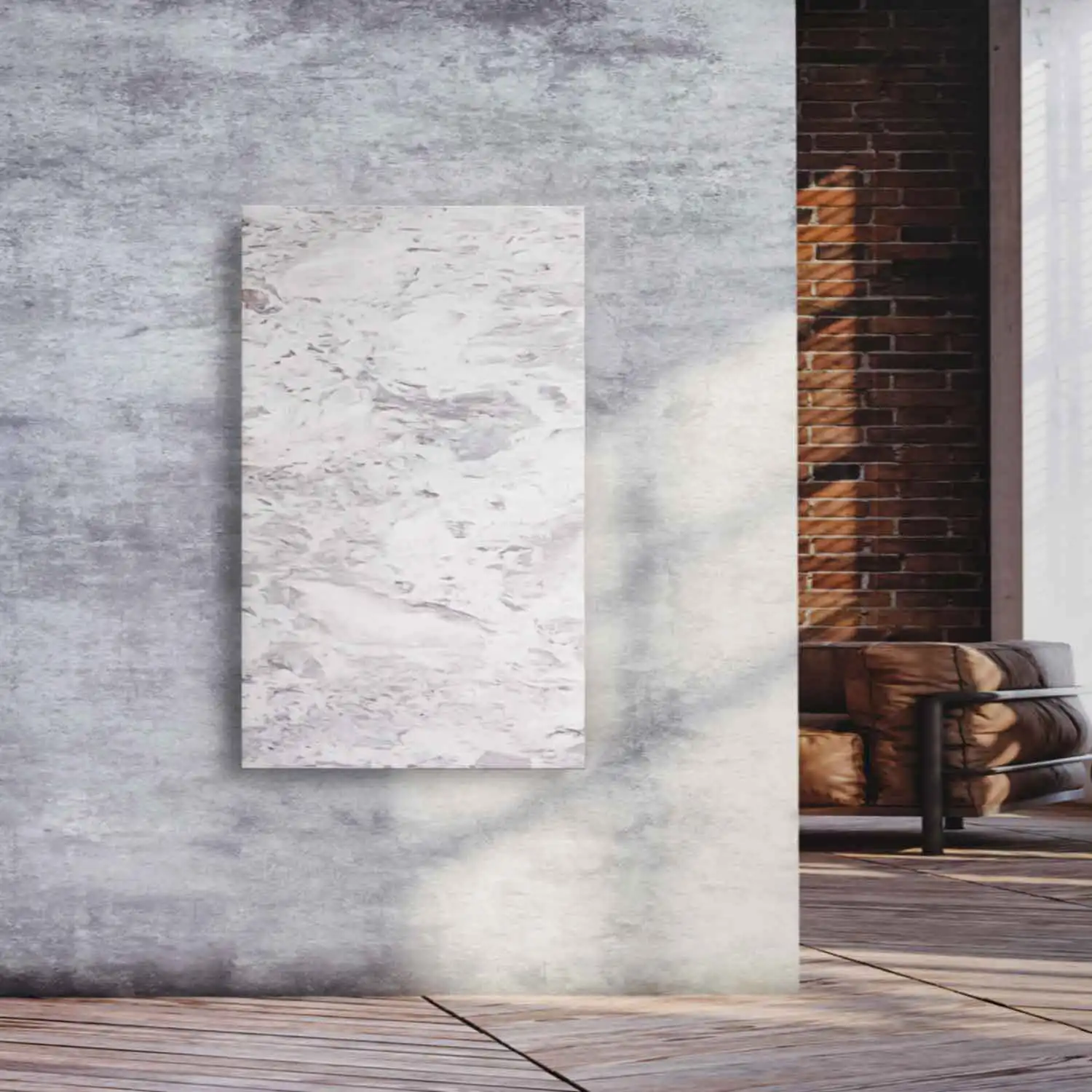 Natursteinheizung Varios als eleganter Wandakzent in einem Loft mit Sichtbeton und Ziegelwand – Luxuswärme